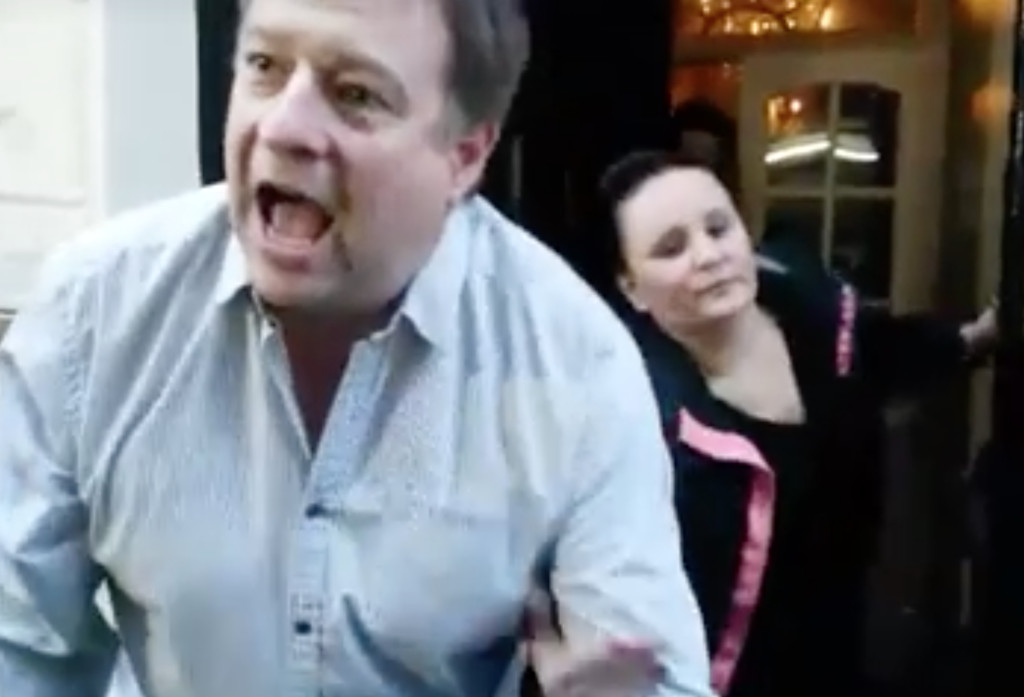 Alexis Gauthier, the chef owner of Gauthier Restaurant in London, is dragged back into restaurant as he asks protesters if they are wearing leather shoes.