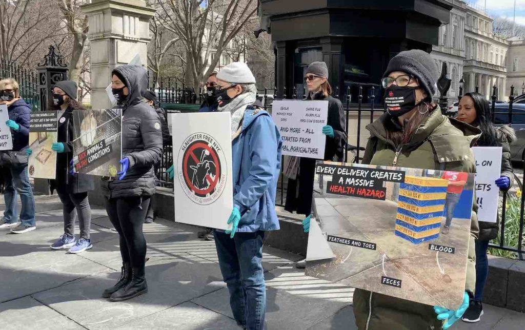 Photo of animal rights and public health advocates protesting live animal markets in NYC