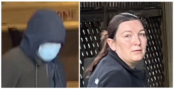 Photo shows Dr. Lauren Postler, a veterinarian with the Humane Society of New York, hiding her face as she exits the building during a protest in October 2022